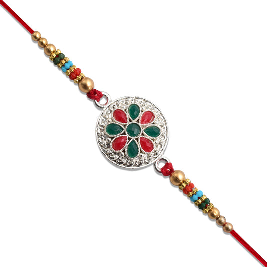 Silver Plated Floral Rakhi With Red  Green Stones